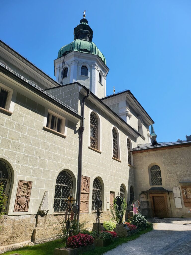 Salzburg Old Town cobblestone street with medieval fortress and Alpine backdrop for a 2-day itinerary.
