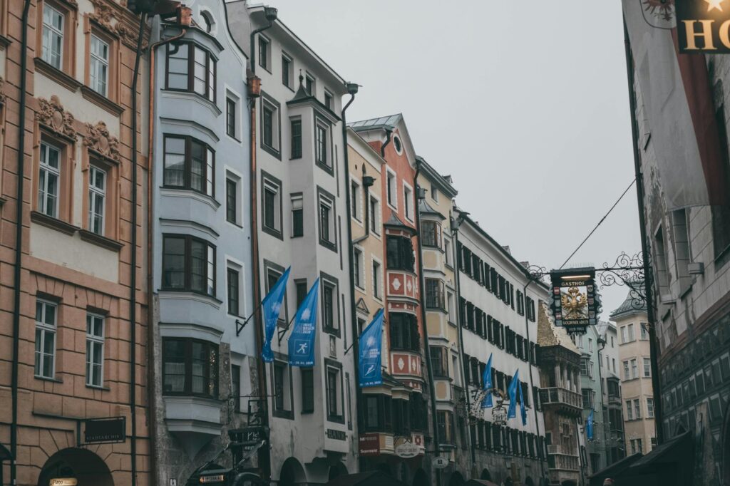 Cobblestone street in a charming, crowd-free European city with historic architecture and colorful buildings.