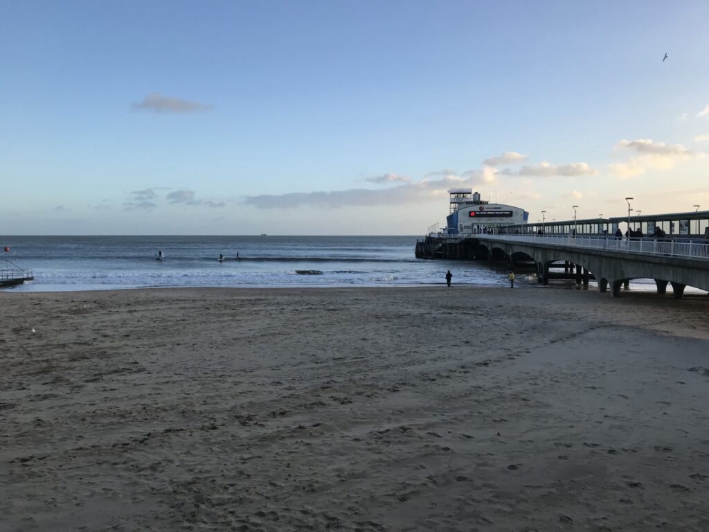 Bournemouth's sandy beach and Victorian pier on a bright South Coast day.