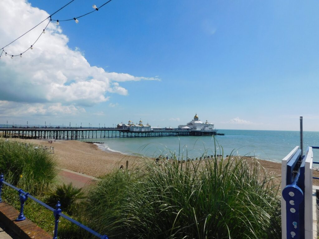 Eastbourne's Victorian pier stretching out over the English Channel on a bright South Coast afternoon.