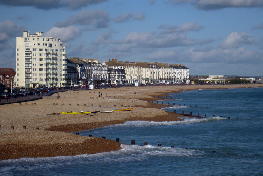 Eastbourne's shingle beach and seafront promenade, looking along the coast from the pier.