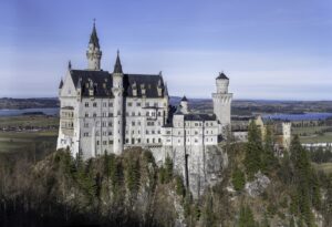 Neuschwanstein Castle on its rocky ridge above the Bavarian countryside, the highlight of any Bavaria road trip