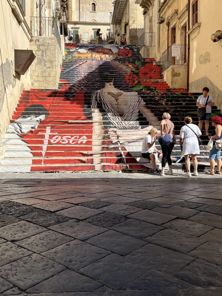 Painted Tosca steps on Via Mariannina Coffa in Noto