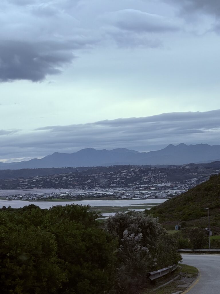 Knysna lagoon and town under storm clouds, seen from the road down from the Eastern Head