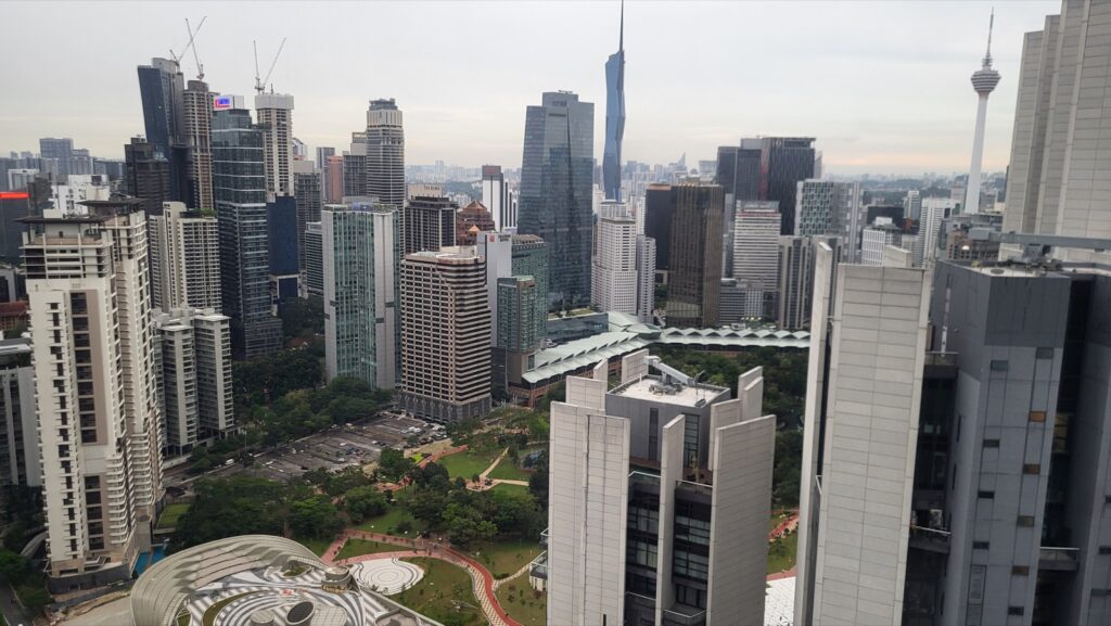 Kuala Lumpur skyline with KL Tower on the horizon and KLCC Park below