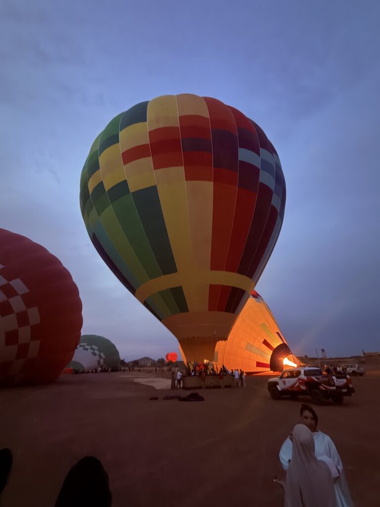 A hot-air balloon being inflated at dawn at the launch site outside Marrakech