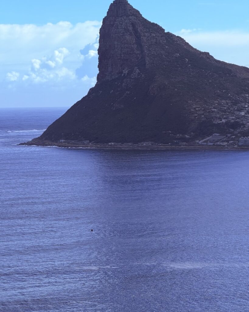 The Sentinel rising out of the sea at the mouth of Hout Bay, seen from Chapman's Peak Drive